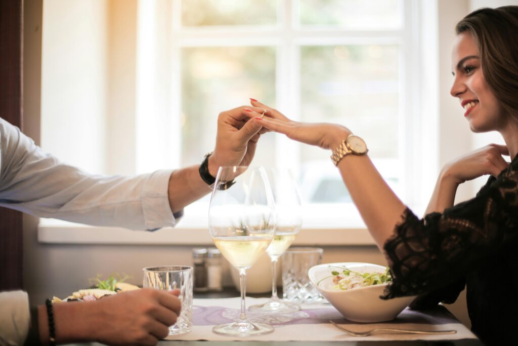 Crop man making proposal in luxurious restaurant during dinner