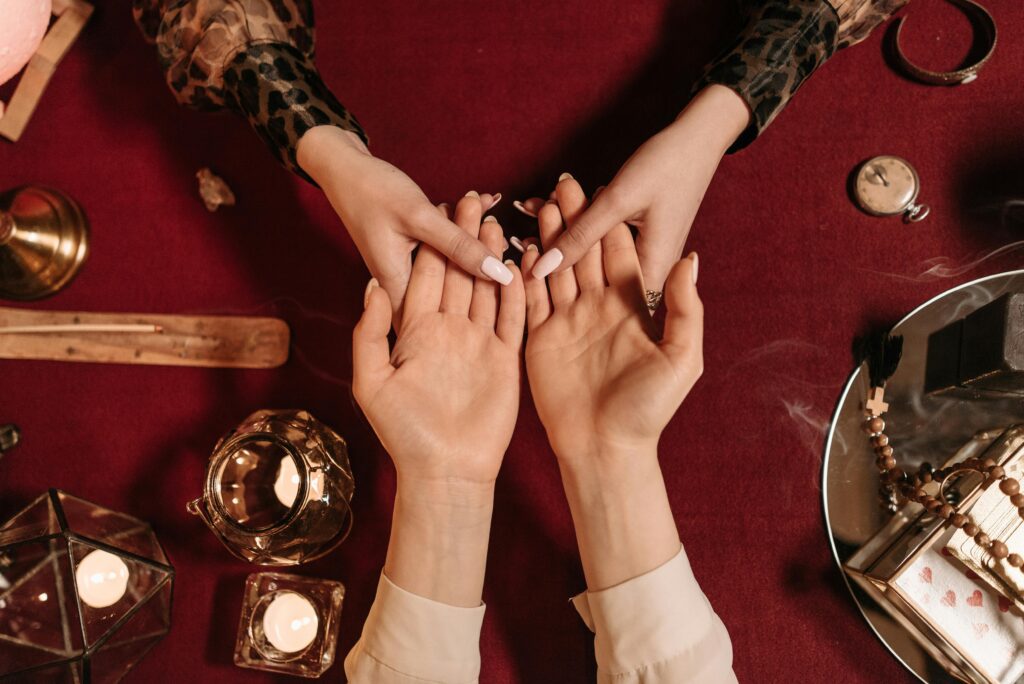 High Angle Shot of Two People's Hands